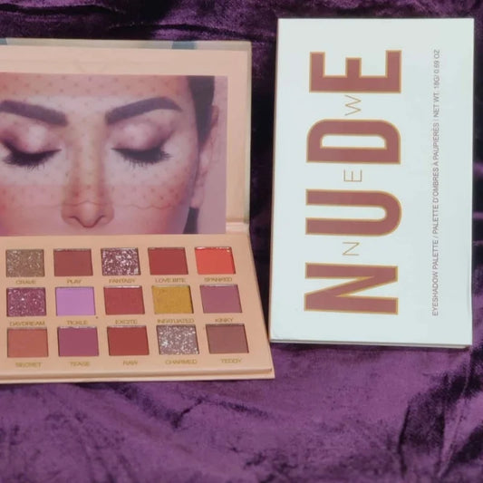 Makeup palette with 'NUDE' packaging on a purple textured
background
long lasting pigmented nude eyeshadow palette for eye makeup