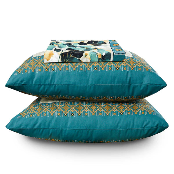 Teal pillows with geometric patterns on a white background