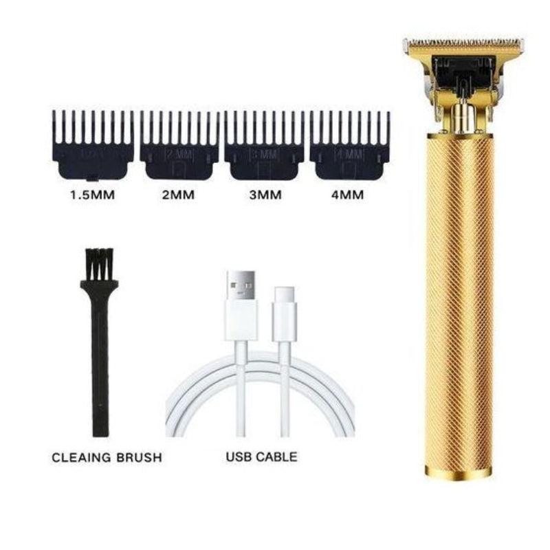 Gold hair trimmer with attachments and cleaning brush on a white background