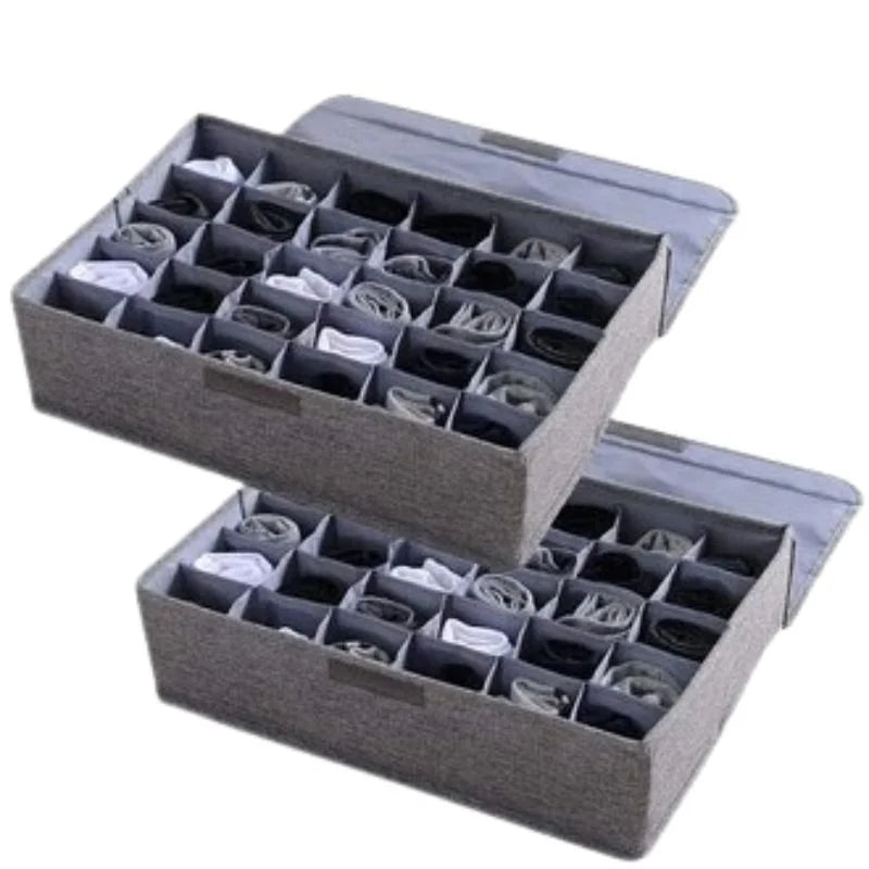 Gray fabric storage box with multiple compartments for organizing items on a white background