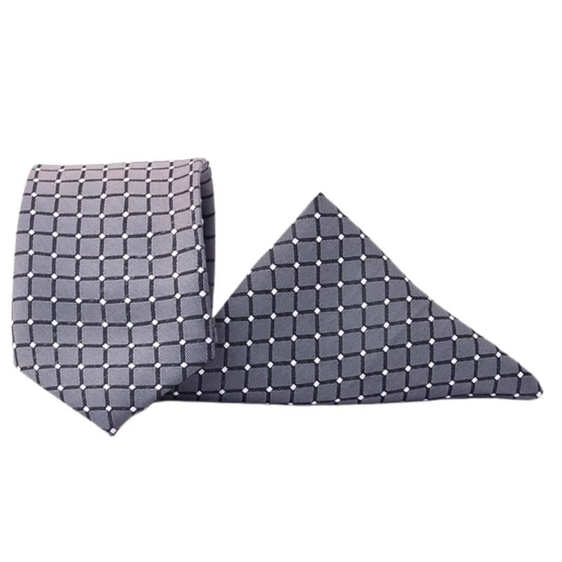 Gray patterned tie and pocket square set on a white background