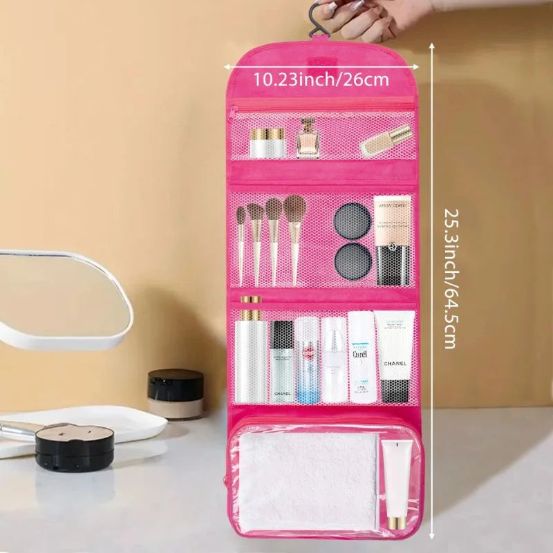 Pink hanging cosmetic organizer with measurements on a beige background