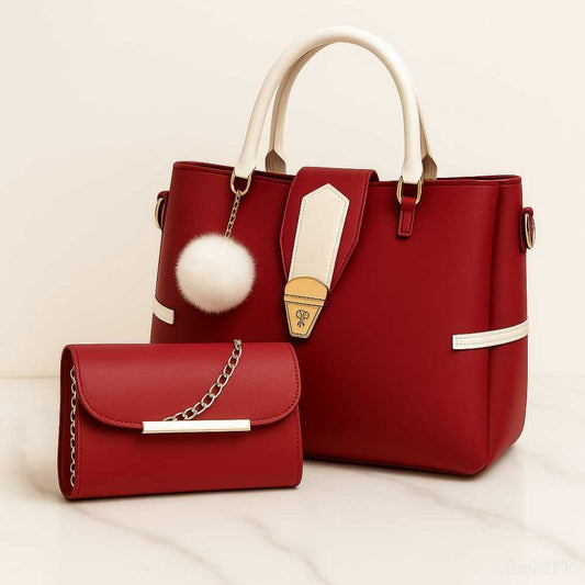 Red handbag with gold accents and a matching wallet on a beige background