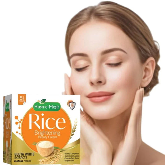 Woman touching her face with a box of Husn-e-Mesir Rice Brightening Beauty Cream on a white background