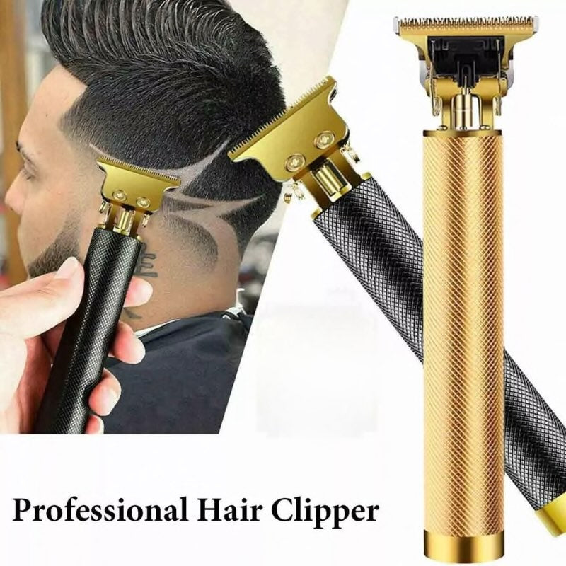 Professional hair clipper with gold and black design, used on a person's head.