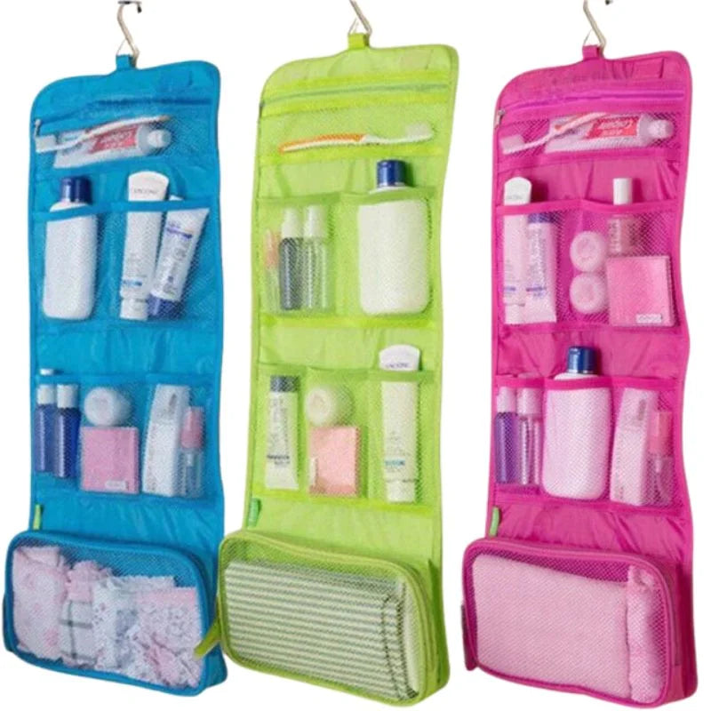 Three colorful hanging toiletry bags with various items inside.