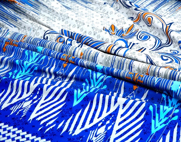 Collection of fabric swatches with blue, white, and orange patterns.