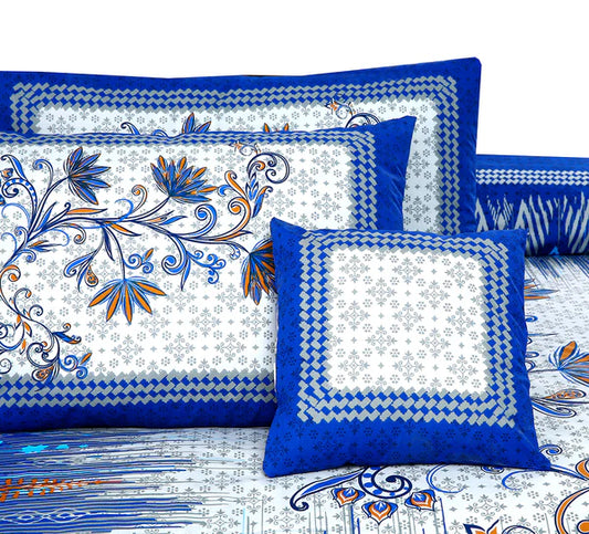 Decorative pillows with blue and white floral patterns on a matching fabric background.