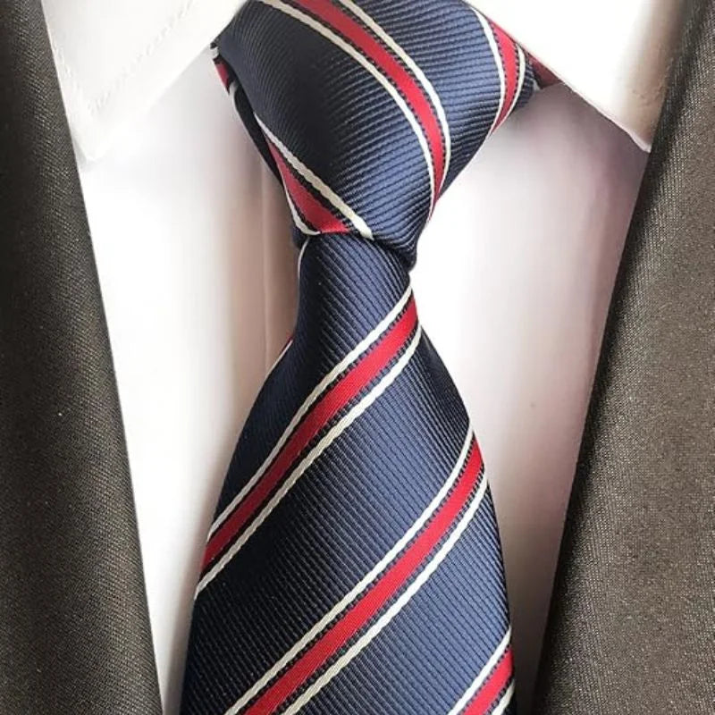 Navy blue tie with red and white stripes on a mannequin.